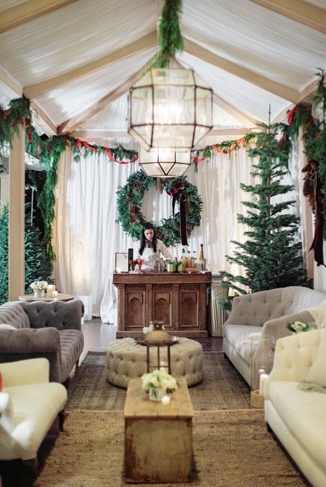 Tented holiday party with white draping, antique lanterns, wreaths, Christmas trees, tufted couches, and wood bar by Beth Helmstetter Events. Holiday party, classic outdoor celebration under tent by Beth Helmstetter. Christmas party inspiration with custom structure. Christmas Tent, Party Tent Decorations, Classy Christmas Party, Christmas Party Inspiration, Christmas Wedding Ideas, Outdoor Christmas Party, Outdoor Holiday Party, Xmas Theme, Greenery Decor