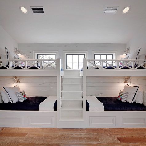 This bunk room was part of a much larger space. We designed and built these great bunks with four twin beds. I wanted it to be a space that would be comfortable for all ages and both boys and girls alike. A navy and white color scheme is both classic and crisp. The fun Otomi embroidered pillows add that fun pop of color on a sea blue cabana stripe. Bunk Bed Rooms, Bunk Beds Built In, Built In Bunks, Bunk Rooms, Bunk Beds With Stairs, Bunk Bed Designs, Kids Bunk Beds, Bunk Room, Bunk House