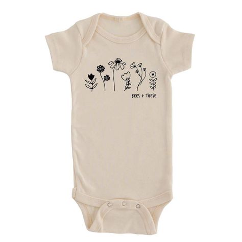 Grab this gender-neutral baby onesie for your little one! Product Details: 100% organic unbleached cotton About Nature Supply Company: Nature Supply Co offers eco-conscious apparel and goods that are made with the planet in mind. Each item sold restores one square foot of degraded soil. Their products are manufactured in an anti-sweatshop environment utilizing organic materials when possible and are made to order to prevent waste. They are Climate Neutral Certified and are a member of 1% For The Wildflower Onesie, Slow Flower, Graphic Onesies, The Bees Knees, Artificial Dyes, Farmer Shirt, Flower Farmer, Kids Birthday Gifts, Bees Knees