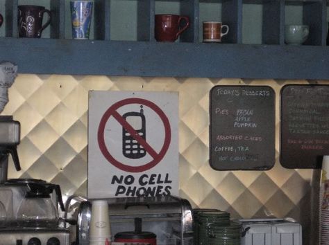 The "No Cell Phones" sign that Lorelai ALWAYS ignores until Luke yells at her...even when they're dating. No Cell Phone Sign, Gilmore Girls Party, No Cell Phones, Luke's Diner, Babette Ate Oatmeal, Snoopy Tattoo, Luke And Lorelai, Lukes Diner, March Break