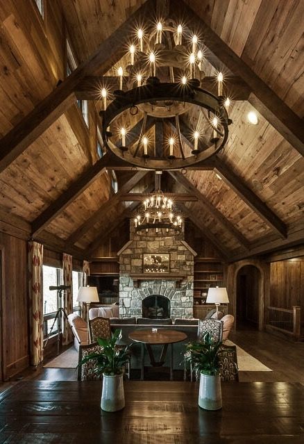 Triple Tier Sorrento Chandeliers in a mountain home. Hunting Lodge Chandelier, Mountain Home Chandelier, Mountain Home Lighting, Citrus Bedroom, Mountain Homes Interiors, Iron Chandelier Rustic, Cabin Chandelier, Cozy Rustic Living Room, Timber Frame Interior