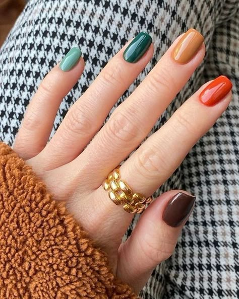 Looking for the perfect nail inspiration this fall? We've got you covered with the best fall nail designs to create a chic manicure! Earth Tone Gel Nails, Fall Skittle Nails 2023, Retro Nail Colors, Fall Colorful Nails, Multi Colored Fall Nails, Multicolored Nails Winter, Winter Nails Multicolor, Skittle Nails Color Combos, Multi Color Fall Nails