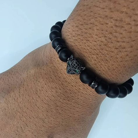 Elevate your dad's style this Father's Day with our Black Onyx Bracelet featuring a bold Black Panther head charm and sparkling Black Zircon spacers. #FathersDayGift #BoldAndStylish #LuxuryJewelry #PantherPower #DadsDeserveTheBest #ElegantGifts #Trendsetter" Panther Head, Black Onyx Bracelet, Dad Fashion, Onyx Bracelet, Bold Black, Bead Designs, Black Panther, Black Onyx, Luxury Jewelry