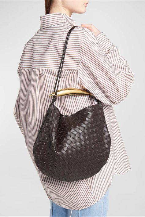 Bottega Veneta top handle bag in intrecciato leather Metal sardine top handle Knot think shoulder strap Can be worn as a top handle or shoulder bag Open top with magnetic closure Interior, leashed zip pouch bag Approx. 8.7"H x 6.1"W x 3.5"D Made in Italy Bottega Sardine Bag Outfit, Bottega Sardine Bag, Bottega Veneta Sardine Bag, Sardine Bag, Classy Bags, Thrift Board, 2023 Wardrobe, Bottega Veneta Bag, Baggage Claim