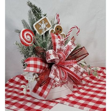 Charming Christmas Arrangement Doubles Both As A Table Piece Or A Wall Hanging Design (Hanger Hole On The Back Of The Container As Shown In Picture). Can Be Use On A Shelf, Side Table, Centerpiece, Office, Or Even Hung On A Wall - A Wonderful Welcome To Any Holiday Home Door! Decorated With Snow Frosted Winter Greenery/Pine, Gingerbread Holiday Picks, Peppermint Sticks, And Accented With A Holiday Bow. A Wonderful Host/Hostess Gift When Visiting Others During The Holidays! This Is For One (1) Holiday Arrangement - It Measures Approximately 20 In High X 16 In Wide X 10 In Deep. The Arrangement Will Be Wrapped In Bubble Wrap For Shipping. When Your Box Arrives, The A Nutcracker Floral Arrangement, Gingerbread Table Centerpieces, Shelf Side Table, Wall Hanging Design, Crafts 2024, Christmas Table Centerpiece, Christmas Dessert Table, Candy Arrangements, Christmas Bazaar