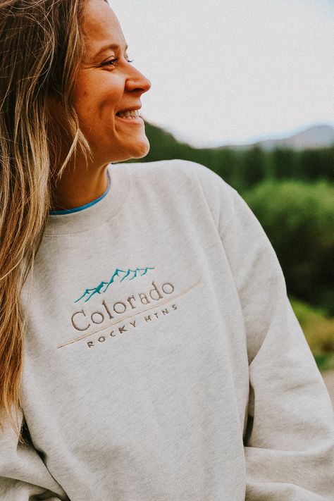 Stay cozy and rep those Colorado vibes with this comfy sweatshirt! 🏔️✨ Perfect for cool mornings, mountain hikes, or just kicking back at home. Grab yours now and take a little piece of the Rockies wherever you go! . . . . . . . . . . #ColoradoLife #RockyMountains #ExploreColorado #ColoradoStyle #MountainVibes #EverythingColorado #ColoradoCrafts #SummitCounty #ShopLocalColorado #ColoradoGifts #AdventureColorado #DenverLiving #ColoradoApparel #MountainLiving #ColoradoSouvenirs #NatureLovers ... Colorado Vibes, Colorado Style, Mountain Vibes, Explore Colorado, Colorado Outfits, Summit County, Mountain Living, The Rockies, Mountain Hiking