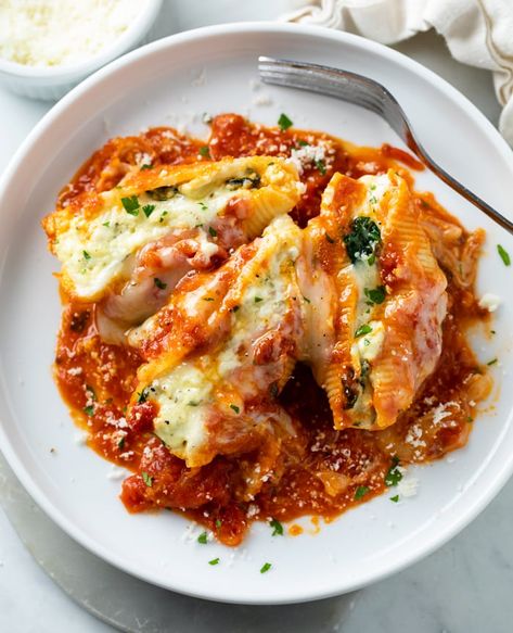 This Classic Stuffed Shells recipe is easy to make with a 4-cheese blend of ricotta, mozzarella, Parmesan, and cream cheese! This is a great make ahead meal that's freezer friendly! Mozerella Recipes Dinners, Stuffed Lumaconi Recipe, Stuff Shells Recipes Ricotta, Big Pasta Shells Stuffed, Stuffed Shells No Ricotta Cheese, Ricotta Filling For Stuffed Shells, Ricotta Cheese Recipes Pasta Stuffed Shells, Meat Stuffed Shells Beef No Ricotta, Baked Stuffed Shells