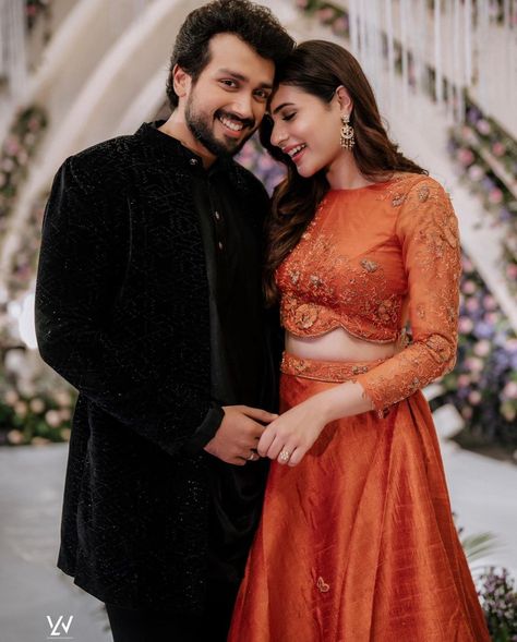 Couple Dresses For Engagement Indian, South Indian Wedding Guest Outfit, Couple Dress Matching Indian Casual, Dress For Engagement Indian, Reception Lehenga Bridal Indian, Engagement Outfits Indian Couple, Couple Dress Matching Indian, Reception Lehenga Bridal, Jaali Door