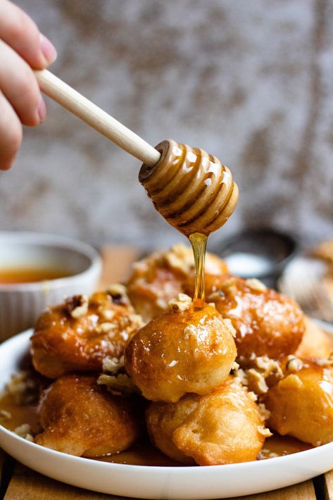 Loukoumades are a delightful dessert from Cyprus and Greece. They are fried donuts coated in honey and sprinkled with cinnamon and walnuts. Cypriot Food, Fried Donuts, European Recipes, Greek Desserts, Easy Summer Meals, Global Recipes, European Food, Food For A Crowd, Donut Recipes