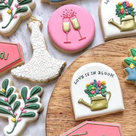 Katie Murphy on Instagram: "Love is in bloom⁣ ⁣ #bridalshowercookies #weddingcookies #weddingdresscookies #floralcookies #loveisinbloom #cincinnaticookies #katebakesohio #champagnecookies" Love In Bloom Engagement Party, Love Is In Bloom Bridal Shower Cookies, Love Is In Bloom Cookies, Love Blooms Engagement Party, Love In Bloom Bridal Shower Ideas, Love In Bloom, Love Is In Bloom, Love Is Blooming Bridal Shower Theme, Love Is In Full Bloom Bridal