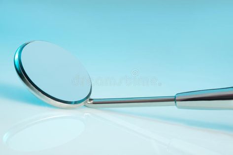 Dental Mirror. A dental mirror on turquoise background #Sponsored , #Ad, #AD, #Mirror, #background, #turquoise, #Dental Mirror Background, Dental Mirror, Photoshop Tutorial Design, Turquoise Background, Medical Technology, Technology Logo, Photoshop Tutorial, Stock Images Free, Photo Image