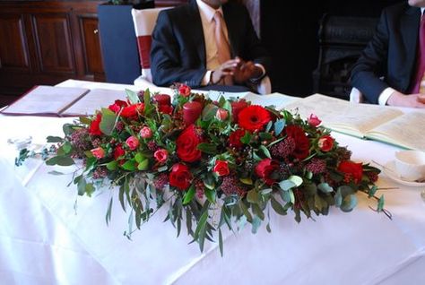 red-roses-gerbera-skimmia-and-tulip-top-table-display Top Table Arrangement, Deep Red Wedding, Top Table Flowers, Church Flower Arrangements, Venue Decorations, Table Arrangement, Flower Inspiration, Wedding Flower Inspiration, Ivory Flowers