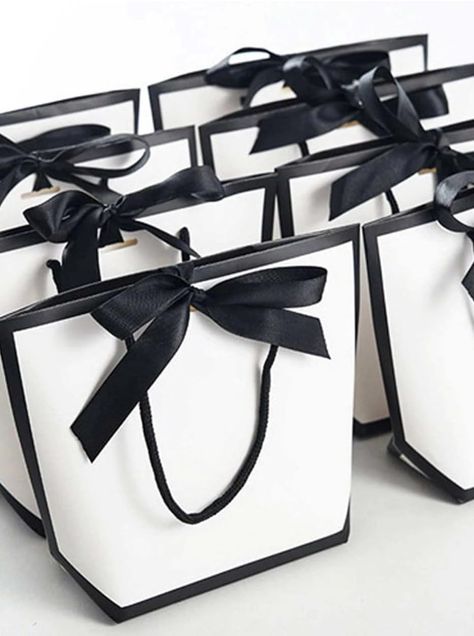 PRICES MAY VARY. Introducing our Elegance Collection Gift Bag: the epitome of sophistication and style Stunning black and white design blending timeless and modern elements seamlessly Crafted with meticulous attention to detail for a crisp, chic look Versatile design perfect for any occasion, from birthdays to weddings High-quality materials ensure durability and luxury Accommodates a variety of gift sizes for perfect wrapping every time Sturdy handles and reinforced construction for easy and el Gift Wrap Storage, Beg Tangan, Craft Tote, Retail Bags, Holiday Gift Bag, Merchandise Bags, Craft Tote Bag, Bow Decor, Party Gift Bags