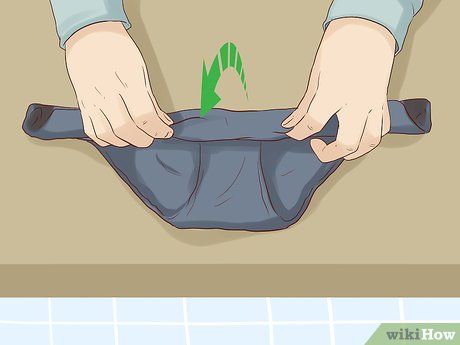 3 Easy Ways to Roll Underwear - wikiHow How To Ranger Roll Clothes, Folding Underware Roll, Folding Underware Men, How To Fold Undies, How To Roll, Sewing Machine Repair, Diy Clothes Hacks, Clothes Hacks, Shirt Folding