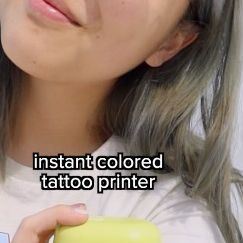 jiragn on Instagram: "#ad testing an instant colored tattoo printer designed by @imprintu_official 😭😭 details 👇 - full unboxing demo and review on my ancient YouTube channel lol - you can upload any image or they have like 12K designs some from real tattoo artists! (highly recommend any designs by sonak or zeevee they’re SO CUTE) - use the primer pls i find my tattoos look dog without them - tattoos last for 24 hours and are waterproof if you use the fixing balm otherwise come off easily like any other makeup - prints in color and in black (no white ink). tattoos are printed in skin mode, check other reels for object mode!! . . #kbeauty #koreanbeauty #koreanmakeup #koreanskincare #oliveyoung #imprintu #임프린투 #temporarytattoos #tattoos #beauty #makeup #makeuptutorial #livinginseoul" White Ink Tattoos, Colored Tattoo, Tattoo Printer, My Tattoos, Olive Young, Real Tattoo, Fake Tattoos, Korean Skincare, White Ink