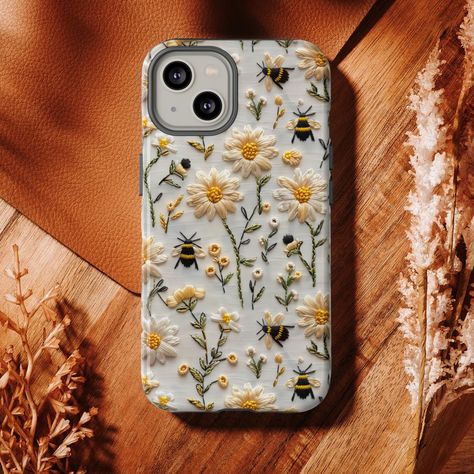 3D Embroidered Foral Bumblebee Phone Case | Faux Embroidery Cute Floral Bees Phone Cover iPhone Google Pixel Samsung Galaxy | Bee Love Supports Wireless Charging! Now includes Google Pixel 8 and Samsung Galaxy S24, S24 Plus, S24 Ultra Highlights: - Cottagecore Spring: Embrace the cozy and nostalgic ambiance of cottagecore with this phone case, featuring a beautiful Delicate Bumblebee design. It adds a touch of nature-inspired elegance to your device, perfectly capturing the essence of the spring season. - Floral Embroidery: The intricate embroidery effect of the Cottagecore Floral Bee design elevates this phone case to a work of art. The delicate details create a stunning visual effect, showcasing the craftsmanship and attention to detail that goes into its creation. - Perfect Fit and Prot Embroidery Phone Case, Cottage Spring, Cottagecore Spring, Embroidery Cases, Faux Embroidery, Embroidery Cute, Core Cottage, Bee Lover Gifts, Phone Cover Design