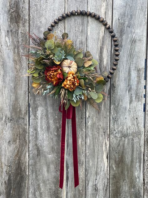 [PaidAd] 'Fall Peony Beaded Hoop Wreath, Farmhouse Style, Autumn Decor, Wood Beaded Wreath, Harvest Wreath, Boho Farmhouse Wooden Fall Wreath, Eucalyptus, Pumpkin, Wheat And Fern Beautiful Fall Beaded Wreath For Any Front Door, Filled With Eucalyptus, Neutrual Pumpkin, Peonies, Wheat, With A Beautiful Burgandy Velvet Ribbon. Made To Order** There Are 8 Different Size Frames Available: 68 Inches (26-28' Tip To Tip) 68 Inches (22-24' Tip To Tip) 68 Inches #fallwreathsforfrontdoordiyeasy Beaded Hoop Wreath, Beaded Wreath, Wreath Eucalyptus, Floral Door Wreaths, Fall Bead, Wood Wreath, Door Wreaths Diy, Fall Door Hangers, Harvest Wreath