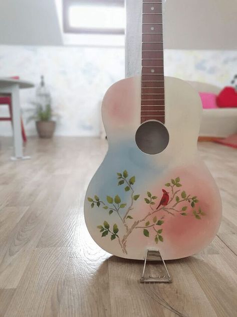 My dad gifted me a guitar many many years ago, and I kept it as a memory after he passed away. I’ve never had musical skills, so using the instrument for playing has never been a thing for me. Painting it was the right thing to do since I wanted to have it on my sight, as a memory of my father. Here’s how this DIY project went. What You Need for This ProjectThis guitar has been made over 30 years ago, in a factory that was pretty known back in time. The instrument has been preserved… Paint Guitar Diy, Paint Guitar, Old Guitar, Happy Signs, Guitar Diy, Diy Guitar, Greek Blue, Ombre Background, Guitar Painting