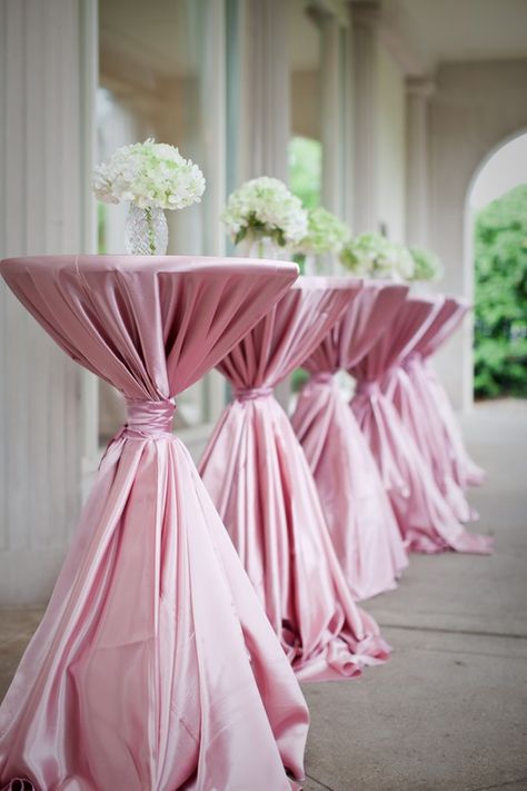 An idea for wedding reception: is decorated in glittering white and soft pink, with endless yards of white and silver fabric and romantically opulent floral arrangements. Description from pinterest.com. I searched for this on bing.com/images Cocktail Table Decor, Outdoor Cocktail Tables, Outdoor Cocktail, Cocktail Hour Wedding, Wedding Table Linens, Deco Rose, Wedding Cocktails, Decorating Coffee Tables, Trendy Wedding