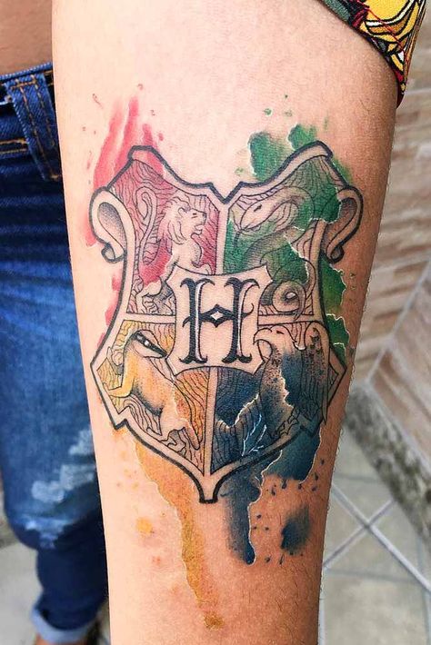 18 Harry Potter Tattoos For True Fans Of The Magical Story | Page 2 of 4 Hufflepuff Crest Tattoo, Harry Potter Crest Tattoo, Hogwarts Crest Tattoo, Harry Potter Always Tattoo, Harry Potter Scar Tattoo, Thigh Tattoo Simple, Watercolor Hogwarts, Harry Potter Quotes Tattoo, Watercolor Heart Tattoos