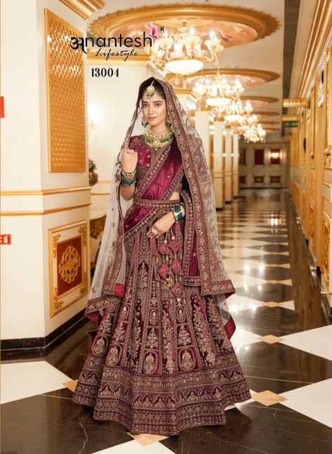 The Wedding Wear Bridal Lycra Velvet Lehenga Cholis are the perfect choice for brides who want a stunning, luxurious look on their special day. With beautiful embellishments and a comfortable fit, you’ll feel like the queen of your day. So, don’t wait! Shop Online today and make your wedding day dreams come true! 👑💖

Price: Rs. 19,175 + Shipping Extra Maroon Velvet Lehenga, Maroon Lehenga, Velvet Suit Design, Anarkali Suits Bollywood, Velvet Lehenga, Frock Style, Bollywood Dress, Purple Saree, Orange Saree