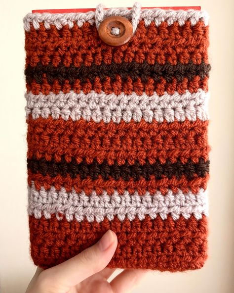 🍂📚 Fall in love with your books all over again with the new autumnal book sleeves! Hand-crocheted with cozy vibes, these sleeves are perfect for keeping your reads snug and safe as the weather cools down. 🍁✨ Each sleeve comes with the option of a handy pocket for your stationery essentials—pens, bookmarks, whatever you need—or without, for a sleeker look. But hurry—these are limited edition! Grab yours and add a touch of handmade warmth to your reading routine. 🍂🧶 Available on Etsy!! #Au... Crochet Book Sleeve, Book Protector, Crochet Book, Book Safe, Stationery Essentials, Small Notebook, Cozy Style, Book Holders, Autumn Gifts