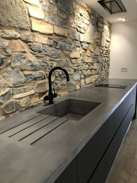 Our longest worktop to date, consisting of a large integral bespoke sink and drain grooves. The client wanted a worktop that seamlessly moulded and complimented the natural stone wall, so after some intricate templating and precise form work, the end result was a totally bespoke kitchen surface.

Finish: Smooth
Colour: Thunder

#bespoke #polished #concrete #polishedconcreteworktop #concretekitchen #polishedconcrete #kitcheninspo #bespokekitchen #kitchenisland #interiors #bespokefurniture Concrete Worktop Kitchen, Polished Concrete Worktop, Concrete Kitchen Sink, Polished Concrete Countertops, Polished Concrete Kitchen, Concrete Worktop, Kitchen Surface, Concrete Countertops Outdoor, Natural Stone Wall