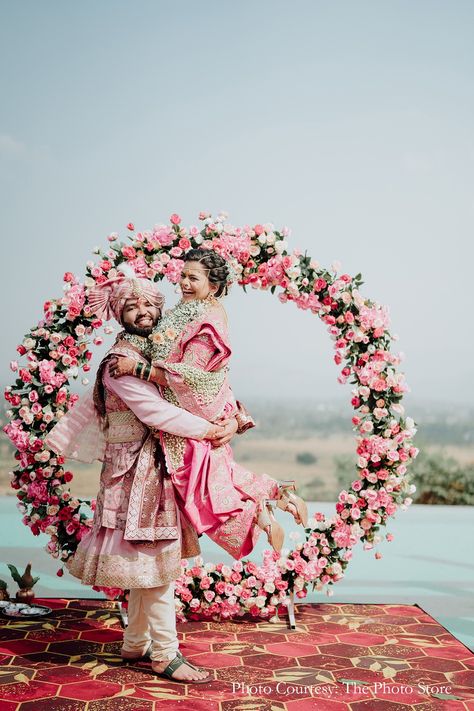 Varmala ceremony, floral setup ideas, pink floral decor ideas, circular floral decor, bride and groom in pink, indian wedding moment, outdoor mandap decor, Indian wedding traditions, outdoor wedding decor, elegant wedding setup, coordinating bride and groom, Maharashtrian bride, varmala inspiration, wedding decor inspiration, minimalistic mandap ideas, bridal inspo Mandap Decor Indian, Outdoor Mandap, Varmala Ceremony, Sufi Night, Mandap Ideas, Maharashtrian Bride, Pink Floral Decor, Cocktail Decoration, Set Decoration