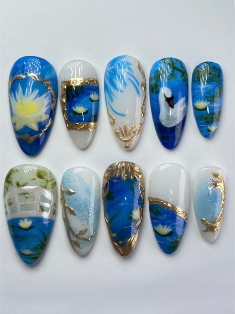 ☆ Blue & Gold Garden Nails ☆ ------- ☆ Why Angelis Nail Studio?: ANS press-ons are made with high quality gels and supplies. I have over 3.5 years of experience with gel nail art and truly put my best effort into each and every set! <3 All sets are made with Apres Gel-X soft gel nail tips, meaning you'll be receiving some of the most durable and flexible nails available. In other words, you'll have salon-quality, reusable gel nails with unique designs -- none of those flimsy, factory-made press-ons here!  ☆ Each purchase includes: - 10 handmade press-on nails  - An application kit with: nail files, cuticle sticks, nail buffer, nail glue, sticky tabs, 70% alcohol prep pads - Application & Removal Instructions  ☆ WEAR:  1-3 days using sticky tabs, and up to 3 weeks using nail glue. Please fo Press On Nails Art, Lily Pad Nail Art, Lily Pad Nails, Van Gogh Nail Art, Blue Nude Nails, Pond Nails, Nails Blue And Gold, Nails Gold Chrome, Nails Cottagecore