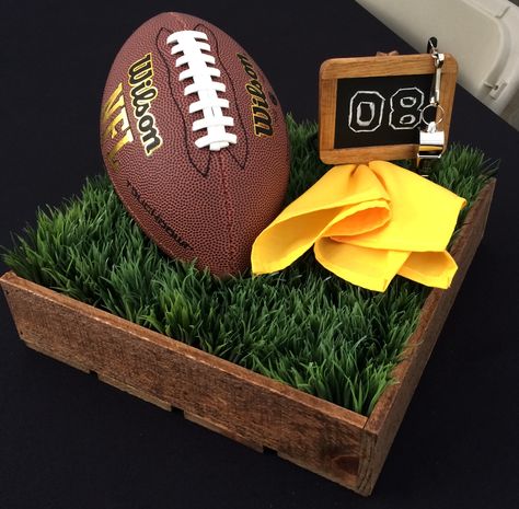 Football centerpiece! Football Themed Luncheon, Football Helmet Centerpieces, Football Centerpiece Ideas Diy, Superbowl Tablescape, Football Tablescape, Football Centerpiece Ideas, Steelers Wedding, Football Banquet Centerpieces, Football Centerpiece