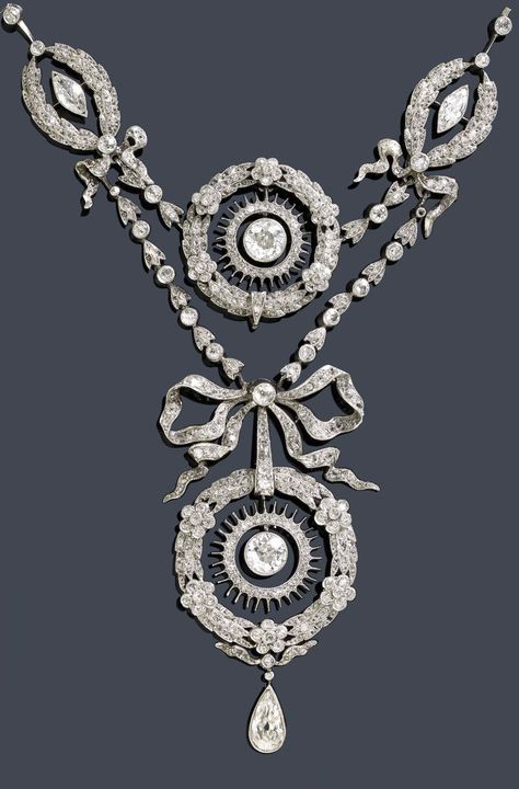 A Belle Epoque platinum and diamond necklace, circa 1900. Designed as floral and foliate garlands, the largest garland surmounted by a bow motif, set throughout with rose-cut diamonds, and suspending a pear-shaped diamond, mounted in platinum. #antique #BelleEpoque #necklace Belle Epoque Jewelry, Antique Diamond Necklace, Bijoux Art Nouveau, Diamonds And Pearls, Edwardian Jewelry, Antique Necklace, Royal Jewelry, Fabulous Jewelry, Antique Diamond