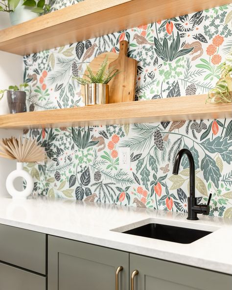 Bold & Beautiful ✨🍸 This cozy wet bar is the perfect pop of personality with muted green cabinets, honey bronze hardware, and a statement-making wallpaper. The floating wood shelves and quartz countertop add a touch of warmth and elegance to the mix. Cheers to a space as functional as it is fun! 🥂 #bold #interiordesign #designer #stl #maryvilleil #roamdesigncompany #modern #organic #spoonflower #wetbar #fyp #trending #wallpaper Making Wallpaper, Floating Wood Shelves, Trending Wallpaper, Muted Green, Quartz Countertop, Green Cabinets, Modern Organic, Bronze Hardware, Wet Bar