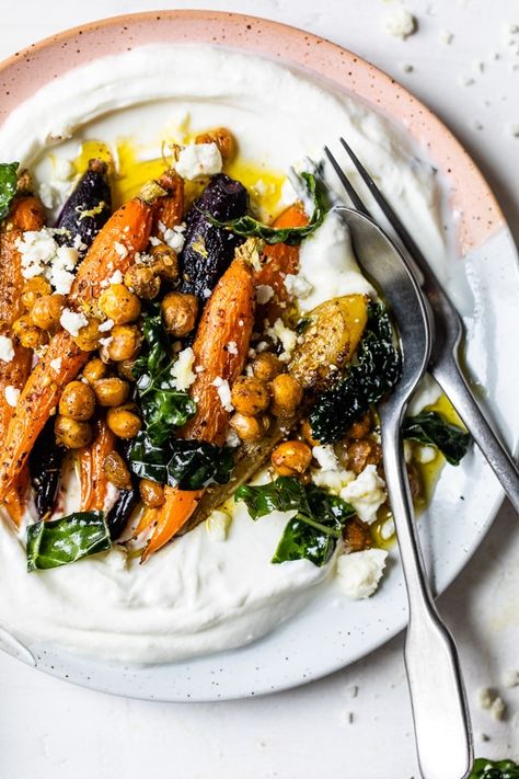 Roasted Carrots and Chickpeas seasoned with za’atar and served over Greek yogurt with lemony kale makes a wonderful side dish or meatless main! #plantbased #yogurtbowls #vegetarian #carrots #chickpeas Roasted Carrots And Chickpeas, Carrots And Chickpeas, Roasted Rainbow Carrots, Yogurt Bowls, Roasted Carrot, Za Atar, Yogurt Bowl, Carrot Recipes, Skinny Taste Recipes