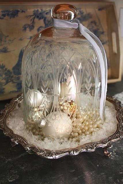 Love this idea...and I see old tarnished silver stuff all the time at the thrift shops, Good Will, etc.  Same with cloches.  This would be real simple to put together. Cloche Decor, Faux Snow, Glass Cloche, The Bell Jar, Noel Christmas, Christmas Deco, Christmas Joy, Christmas Inspiration, Christmas Table