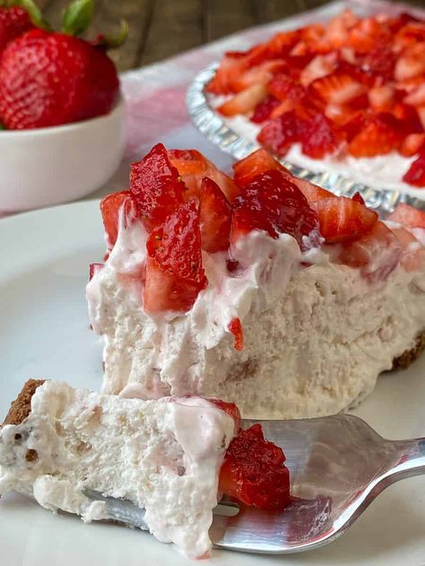 Fork full of the best yogurt pie with whipped topping and yogurt