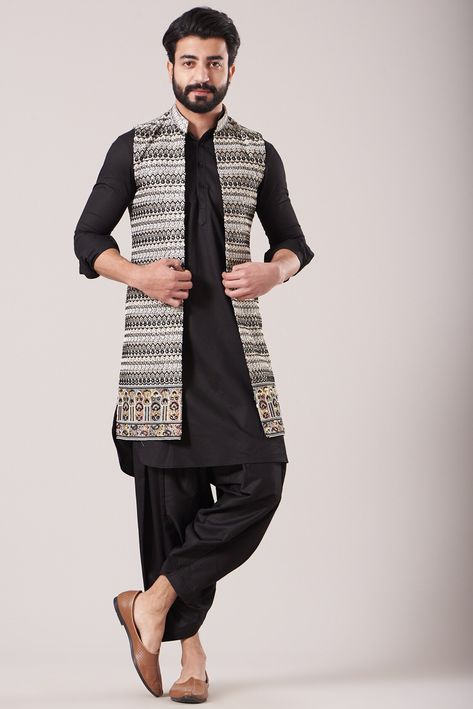 Featuring a white long jacket in silk base with print. It is paired with a contrasting black pathani kurta and salwar pants.  FIT: True to size. COMPOSITION: Silk. CARE: Dry clean only. Pathani For Men With Jacket, Black Pathani, Black Silk Kurta, Kurta Set With Jacket, Pathani For Men, White Long Jacket, Pathani Kurta, Silk Kurta Set, Salwar Pants