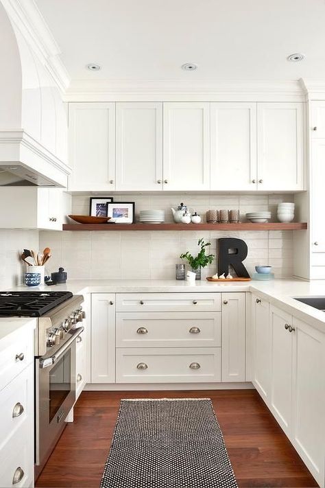 The U-Shaped kitchen layout is perfect for homeowners lacking space or looking to optimize their existing kitchen design. With three walls of cabinets and counter tops, the U-shaped design provides plenty of space and functionality. It also provides an efficient kitchen work triangle for cooking connoisseurs. Visit our latest blog to learn more about how to optimize a U-shaped kitchen design. Small U Shaped Kitchen, White Shaker Kitchen Cabinets, Work Triangle, Efficient Kitchen, Shaped Kitchen, White Shaker Kitchen, White Shaker Cabinets, Shaker Kitchen Cabinets, Diy Kitchen Remodel