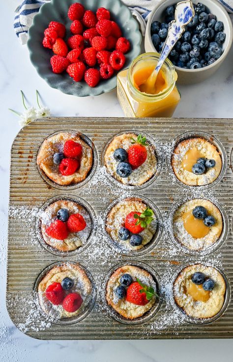 Mini Dutch Baby Pancakes (in a muffin tin). These mini, bite-size Dutch Baby pancakes are made the same way as traditional German pancakes but these are baked in muffin tins. These easy, golden and buttery mini puffed pancakes are perfect to serve to family and friends. Individual German Pancakes, Muffin Tin Dutch Babies, Mini Dutch Baby Pancakes, Muffin Tin Pancakes, Mini Dutch Baby, Mini German Pancakes, Mini Dutch Pancakes, Pancake Cups, Dutch Baby Pancakes