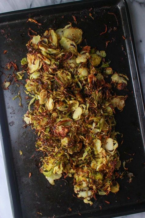 Transform your side dish game with these oven-roasted crispy Brussels sprouts shreds. Perfectly caramelized and delightfully crunchy, this recipe brings out the natural sweetness of Brussels sprouts while adding a satisfying texture. Whether you're hosting a dinner party or just craving a healthy snack, these shreds are sure to impress. Easy to make and packed with flavor, they're a delicious way to enjoy your veggies. Give them a try and watch them disappear from the plate! Convection Oven Brussel Sprouts, Hopdoddy Brussel Sprouts, Sauteed Shredded Brussel Sprouts, Brussel Sprouts Shredded, Crispy Baked Brussel Sprouts, Shredded Roasted Brussel Sprouts, Brussel Sprout Shredded Recipes, Shredded Sprouts Recipes, Shredded Brussel Sprouts Recipes