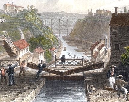 Illustration: view east of eastbound Lockport on the Erie Canal, by W.H. Bartlett, 1839. Credit: Wikimedia Commons. Read more on the GenealogyBank blog: “Opening of Erie Canal Connects East and West” https://blog.genealogybank.com/opening-of-erie-canal-connects-east-and-west.html Construction Video, Erie Canal, Lake Champlain, Lake Erie, New York State, Historical Society, Great Lakes, Empire State, East Coast