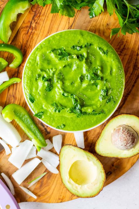 Guacamole's cousin from the south, try this creamy, tart, and herby avocado salsa from Venezuela. Guasacaca con aguacate is the perfect condiment for arepas, empanadas, tequeños, tacos, and more. Try this staple of Venezuelan cuisine, a delicious sauce full of bright, fresh flavors! Avocado Sauce For Tacos, Sauce For Tacos, Vegan Bean Burger, Mexican Guacamole, Plant Recipes, Cilantro Salsa, Avocado Salsa Recipe, Mexican Sauce, How To Make Guacamole