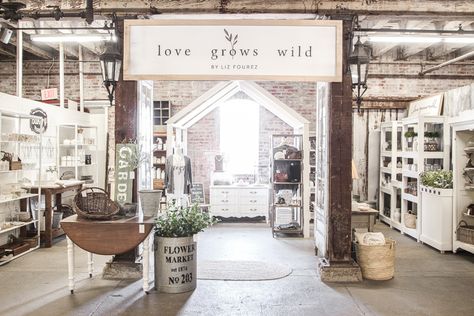 Home and lifestyle blogger Liz Fourez takes you on a tour of her retail shop in Indiana with her favorite home decor pieces and the unique displays she built to create a destination to shop in. Owning A Retail Store, Retail Accent Wall, Farmhouse Retail Store, Industrial Retail Design, Liz Fourez, Wood Pillars, Antique Faucet, Antique French Doors, Antique Booth Ideas