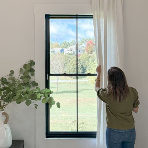 While building our home, we knew the windows and doors would be key focal points in the design. The black frames provide a striking contrast against the white exterior, making them stand out beautifully. The craftsmanship from Pella exceeded our expectations, and we couldn’t be happier with our decision! #pellawindows #pellainspired @pellawindows #modernfarmhouse #modernfarmhousestyle #modernfarmhouseexterior #blackwindows #blackwindowframes #homedesignideas #homebuild #customhomedesign #p... Window Casing Black Windows, White Trim Bathroom, Black Grid Windows, Modern Farmhouse Windows, Black Interior Windows, Black Trim Windows, Grid Windows, Black Window Frames, Pella Windows