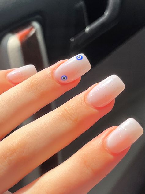 medium length acrylic nails with evil eye design Evil Eye White Nails, White Evil Eye Nails, Simple Evil Eye Nails, Evil Eye Nail, Evil Eye Nails, Natural Nail Designs, Plain Nails, French Nail Designs, White Nails