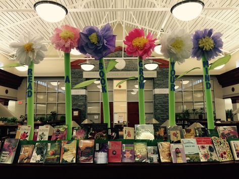 A bright and tall library display. "Read a Book; Grow Your Mind." Tissue paper and pool noodles.  All of the books have flowers on the covers. Read Grow Inspire Book Week Display, Book Week 2023 Read Grow Inspire, Read Grow Inspire Book Week, Book Week 2023, Read Grow Inspire, Book Week Display, Tall Library, Media Center Decor, School Library Book Displays