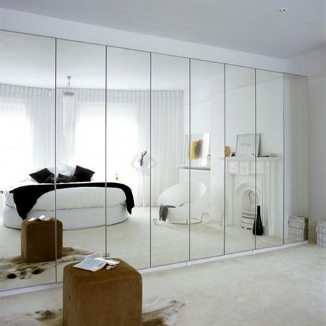 White mirrored bedroom. Mirrored storage kills two birds with one stone, and creates a light, bright and airy bedroom.  #Sleeptember White Mirror Bedroom, Garderobe Design, Airy Bedroom, Mirror Wall Bedroom, Mirrored Wall, Appartement Design, Mirrored Wardrobe, 아파트 인테리어, غرفة ملابس