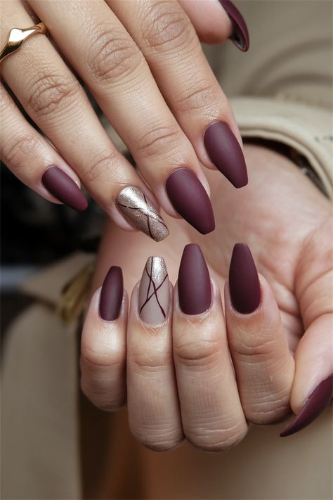 Elevate your autumn look with these stunning matte burgundy fall nail ideas for 2024! This chic color perfectly embodies the warmth of the season while offering a sophisticated edge. Matched with gold foil accents, your nails will capture attention and compliments all season long. Discover how to achieve this elegant style at home and embrace the beauty of fall. Are you ready to flaunt these fabulous nails? #FallNailIdeas #NailArt #BurgundyNails #2024Trends Matte Mauve Nails With Accent, Autumn Foil Nails, Brown And Purple Nails, Mauve Nails, Fall Nail Ideas, Autumn Look, Burgundy Nails, Foil Nails, Deep Burgundy