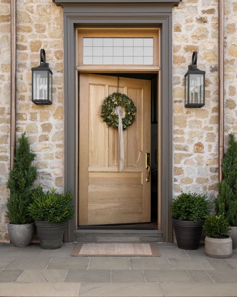 In a crisp black hue, this iron wreath hanger is simplistic and modern. Hanging any wreath, real or faux, for any season, this wreath hanger is a year-round staple. | McGee & Co. | Metal Wreath Hanger Oversized Front Door Entrance, Outside Door Decor Front Entry Modern, Wreath On Double Doors, Stone Around Front Door, Front Door Styling, Brick House Front Door, Simple Front Porch Ideas, Wide Front Door, Outdoor Entryway Ideas