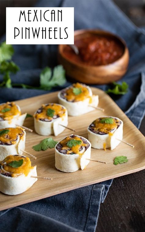 Mexican Pinwheels. These Mexican Roll Ups with Black Beans and Cheese are a super easy, vegetarian appetizer. It's also the perfect, Cold Mexican Appetizer - great for warm days when no bake recipes are the only option! #mexican #appetizers #coldappetizers #cincodemayo #appetizers #appetizer #lmrecipes