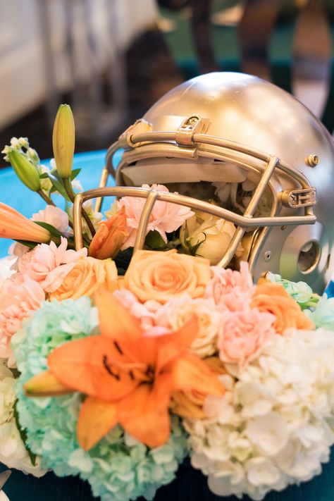 Football themed event for my Miami Dolphins Client held at the intercontinental hotel Miami. Centerpieces and flower arrangements by 24 West   Www.24westdesigns.com  #wedding #weddingideas #weddinginspiration #weddingforward #weddingday #weddingceremony #weddingcenterpieces #centerpiece #flowerarrangements #flowerdesign #tabledecor #weddingflorist #weddingplanners #WeddingPlanning #eventplanner #footballparty #footballdecor #footballdesign #helmetdesign Football Themed Wedding Reception, Football Wedding Theme, Football Centerpieces, Jazz Wedding, Grooms Table, Football Wedding, Floral Design Classes, Football Theme Party, Intercontinental Hotel